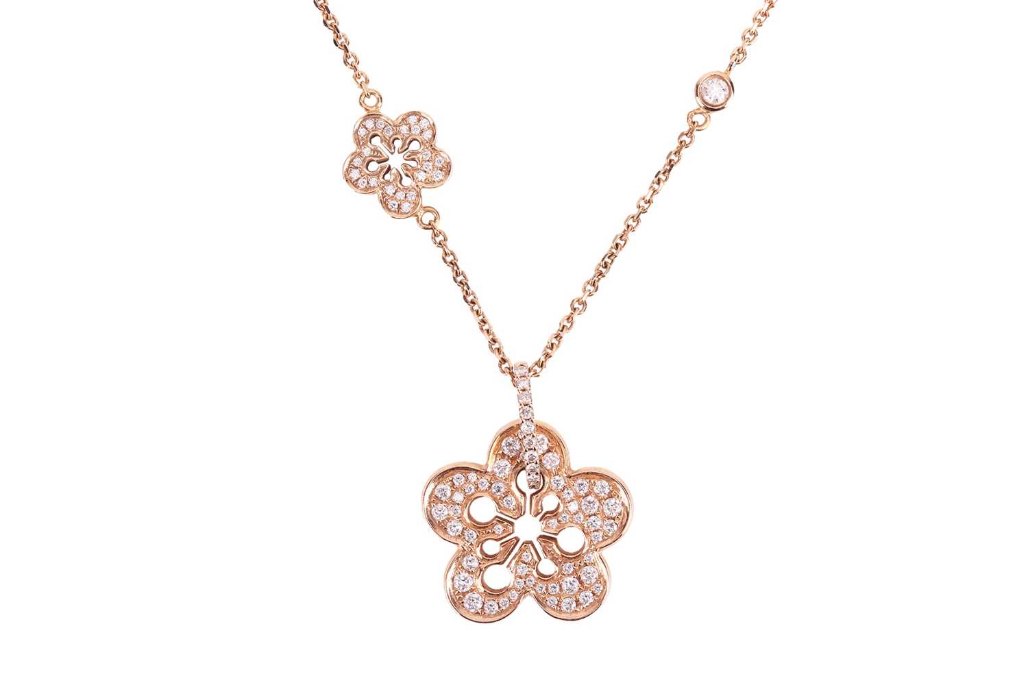 Lot 97 - Boodles - a diamond-set "Blossom" pendant on...