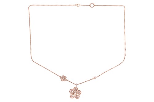 Lot 97 - Boodles - a diamond-set "Blossom" pendant on...