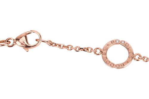 Lot 97 - Boodles - a diamond-set "Blossom" pendant on...