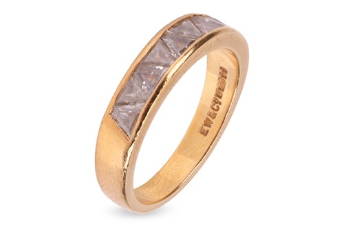 Lot 318 - A trillion-cut diamond half eternity ring in...