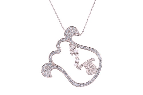 Lot 45 - A modern pale-blue topaz and diamond pendant...