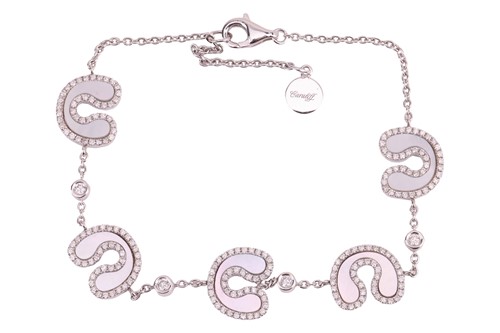 Lot 124 - A modern mother-of-pearl and diamond bracelet...