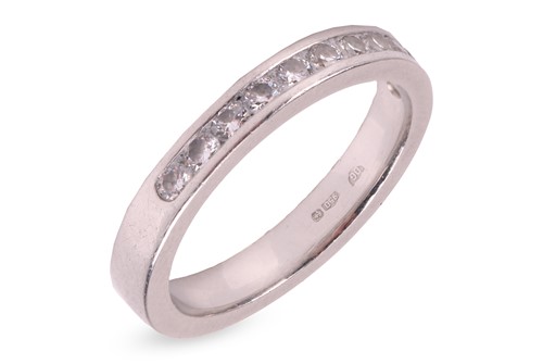 Lot 29 - A modern platinum and diamond half-eternity...
