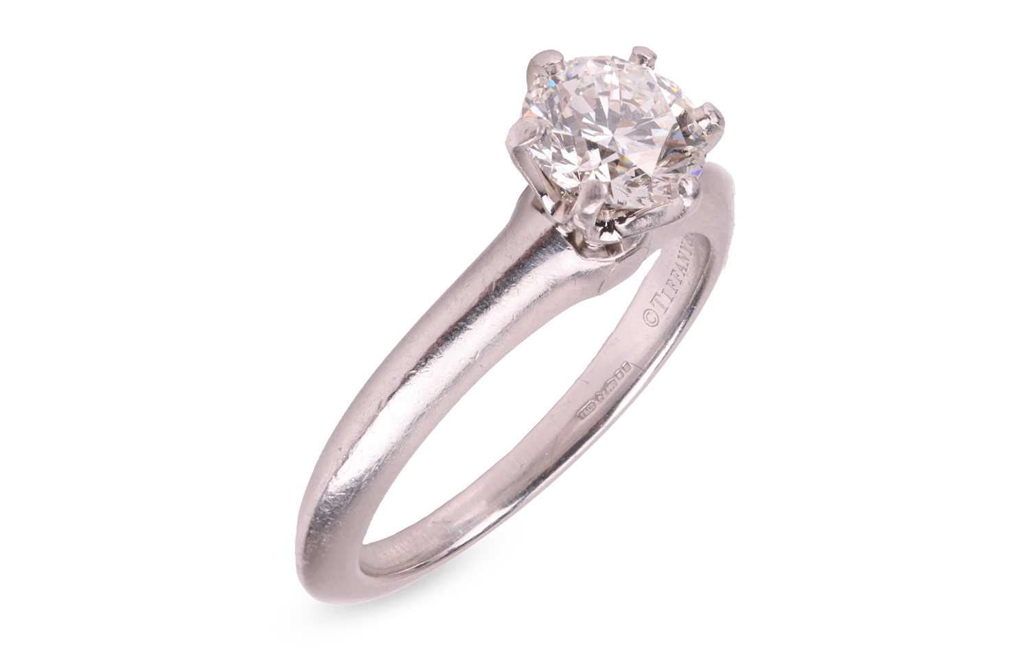 Lot 247 - Tiffany & Co – A diamond solitaire ring,...