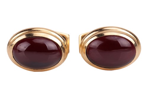 Lot 212 - A pair of 18ct gold and garnet cufflinks, each...