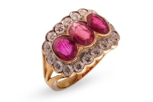 Lot 3 - A ruby and diamond cluster ring, set with...