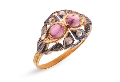 Lot 111 - A ruby cabochon and rose-cut diamond dress...
