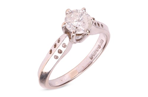Lot 187 - A diamond solitaire ring, comprising a central...
