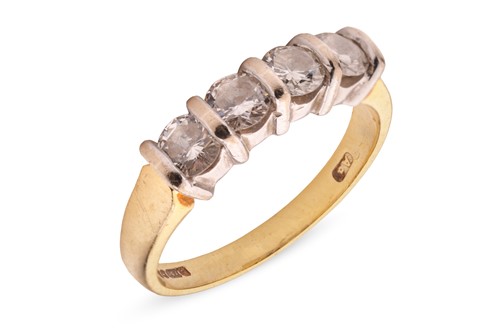 Lot 320 - A diamond half-hoop ring in 18ct gold, with an...