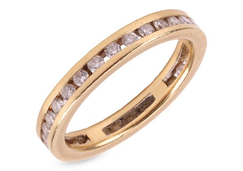Lot 270 - A diamond-set full eternity ring, channel-set...