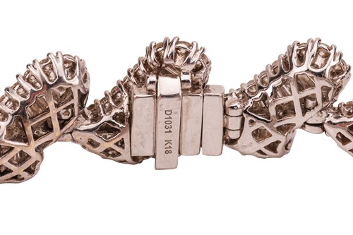 Lot 163 - A diamond-set bracelet of stylised petal...