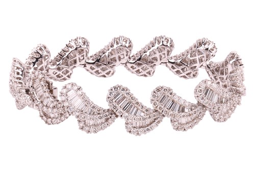 Lot 163 - A diamond-set bracelet of stylised petal...