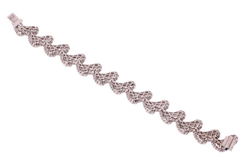 Lot 163 - A diamond-set bracelet of stylised petal...