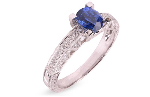 Lot 9 - A sapphire and diamond dress ring, of...