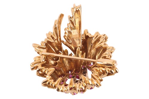 Lot 67 - A Modernist brooch set with pink sapphire and...
