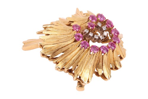 Lot 67 - A Modernist brooch set with pink sapphire and...