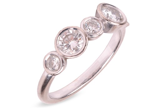 Lot 55 - A diamond half-hoop ring, with an estimated...