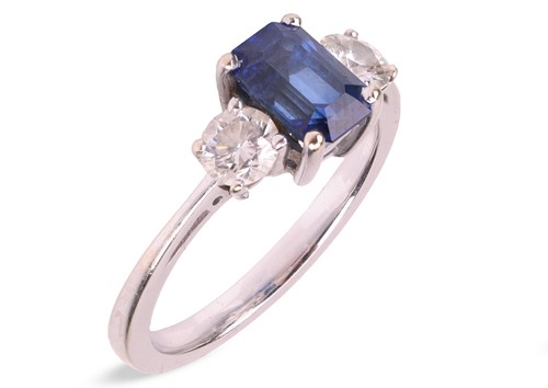 Lot 248 - A sapphire and diamond three-stone ring in...