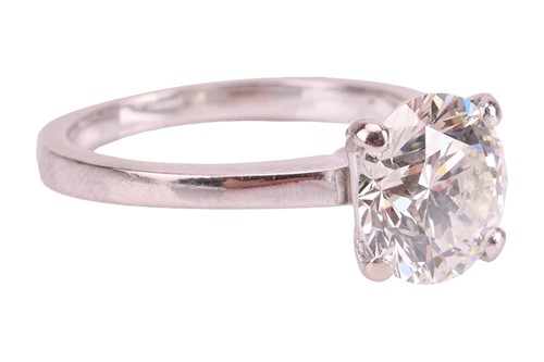 Lot 322 - A diamond solitaire ring in 18ct white gold,...