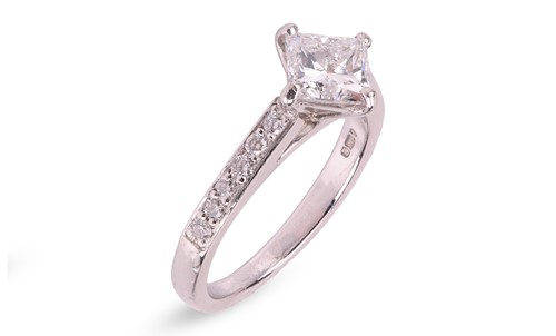 Lot 294 - A princess-cut diamond solitaire ring in...
