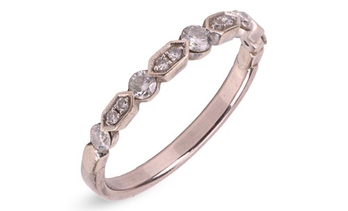 Lot 7 - A diamond-set half eternity ring, with an...