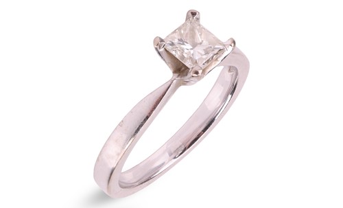 Lot 78 - A princess-cut diamond solitaire ring in 18ct...