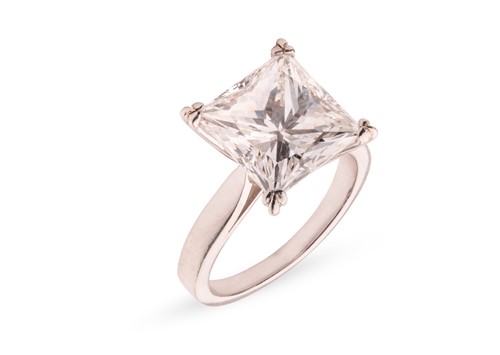 Lot 244 - A princess-cut diamond solitaire ring,...