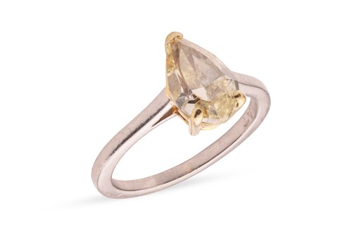 Lot 110 - A pear-cut fancy yellow diamond solitaire ring,...