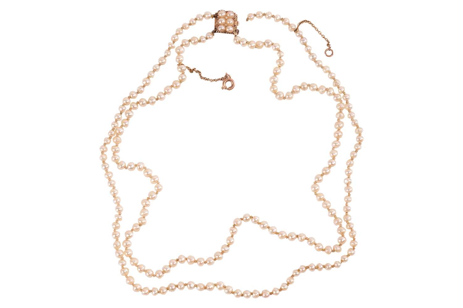 Lot 17 - A double-row natural saltwater pearl necklace,...
