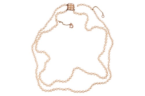 Lot 17 - A double-row natural saltwater pearl necklace,...