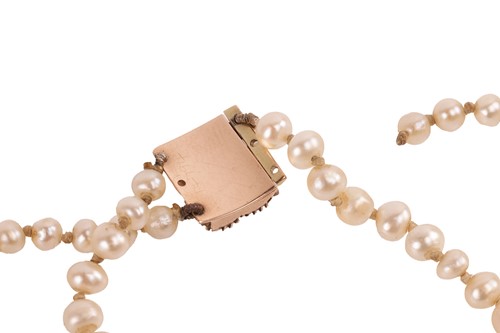 Lot 17 - A double-row natural saltwater pearl necklace,...