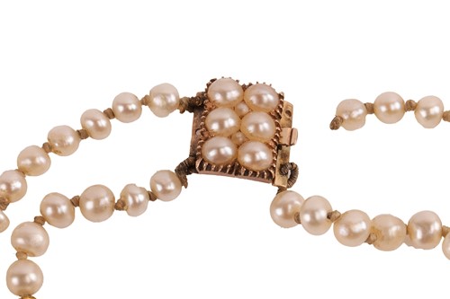 Lot 17 - A double-row natural saltwater pearl necklace,...