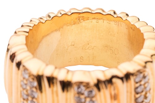 Lot 37 - Cartier - a diamond-set "Casque D'or" ring,...
