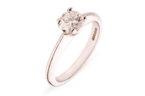 Lot 130 - A diamond solitaire ring in 18ct white gold,...