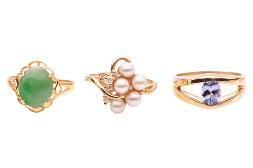 Lot 251 - A group of three gem-set rings; The first a...