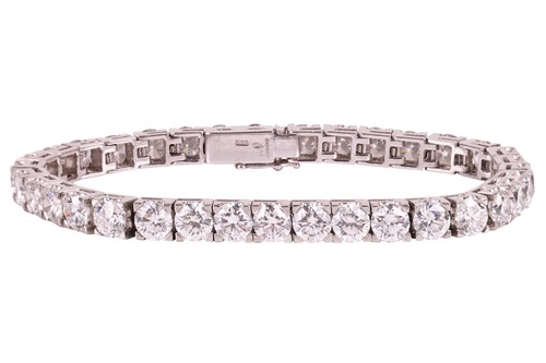 Lot 245 - An impressive diamond-set line bracelet, with...