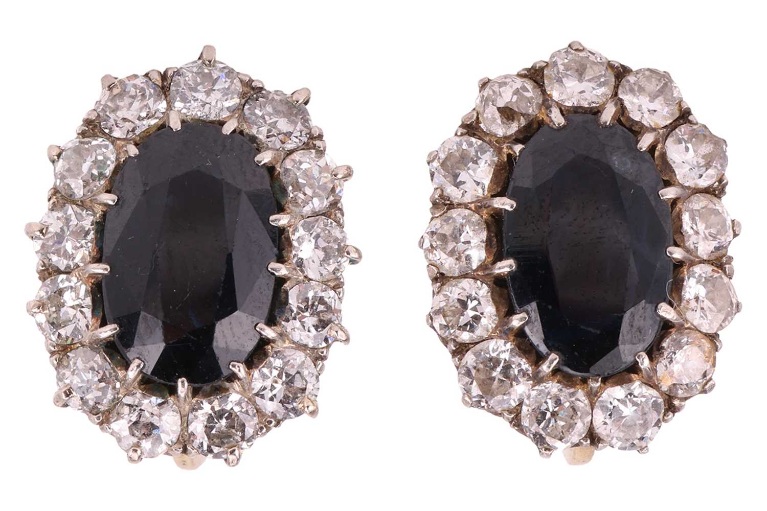 Lot 80 - A pair of sapphire and diamond cluster...
