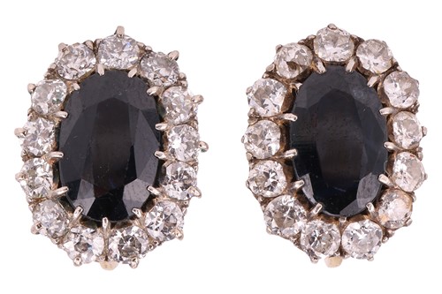Lot 80 - A pair of sapphire and diamond cluster...