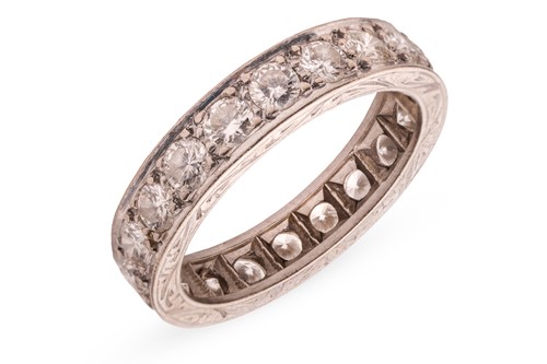 Lot 154 - A diamond eternity ring, grain-set with twenty...