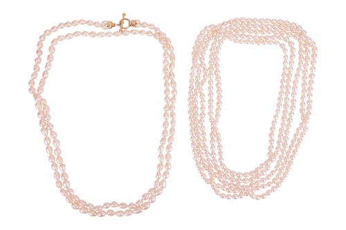 Lot 192 - Two opera-length cultured pearl necklaces; the...