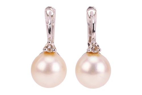 Lot 185 - A pair of cultured pearl earrings, each...