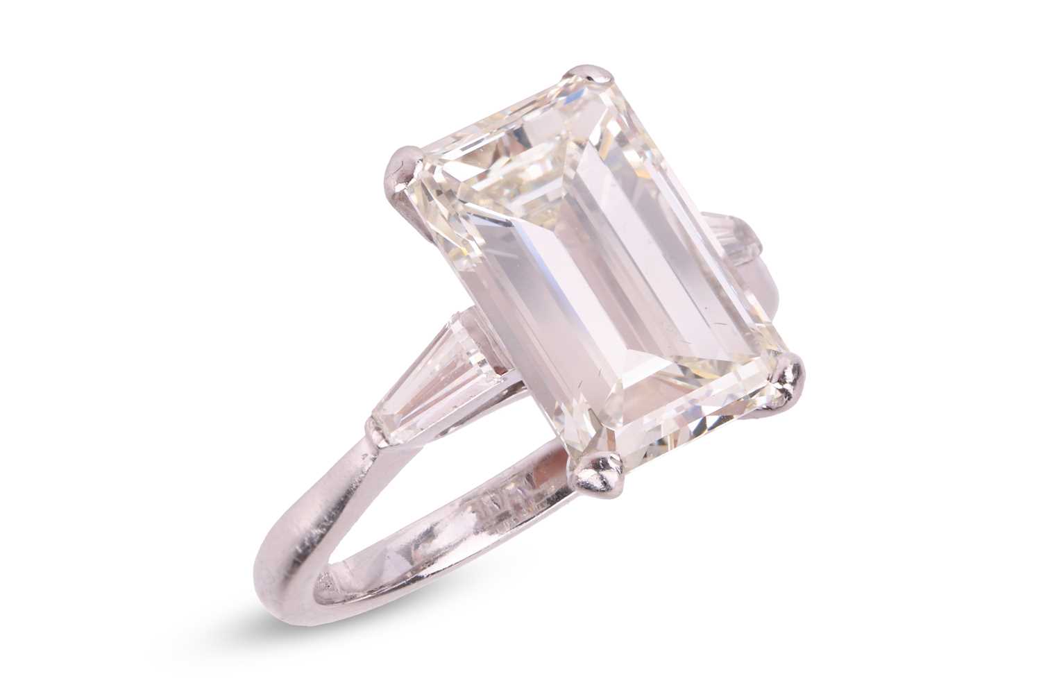 Lot 62 - Kutchinsky - an emerald-cut diamond solitaire,...