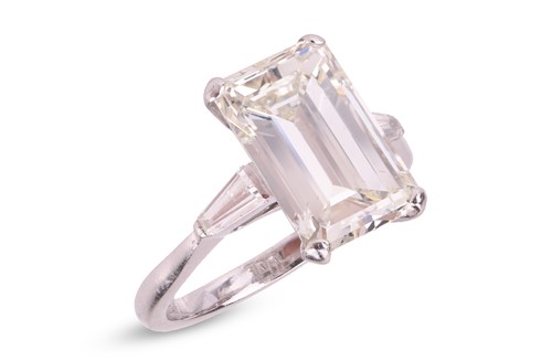 Lot 62 - Kutchinsky - an emerald-cut diamond solitaire,...
