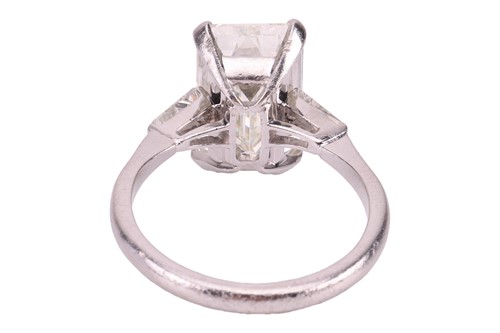 Lot 62 - Kutchinsky - an emerald-cut diamond solitaire,...