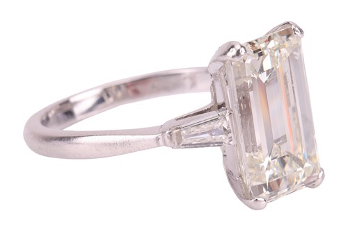 Lot 62 - Kutchinsky - an emerald-cut diamond solitaire,...