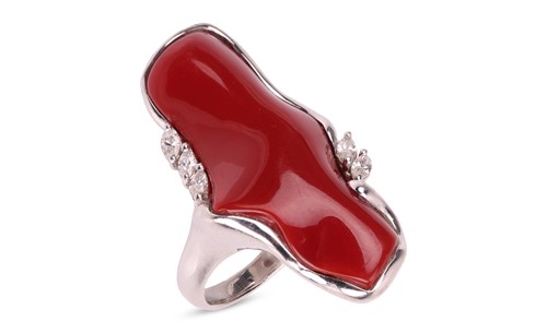 Lot 135 - A coral and diamond cocktail ring, featuring a...