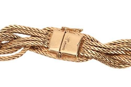 Lot 99 - A braided collar necklace in 18ct yellow gold,...