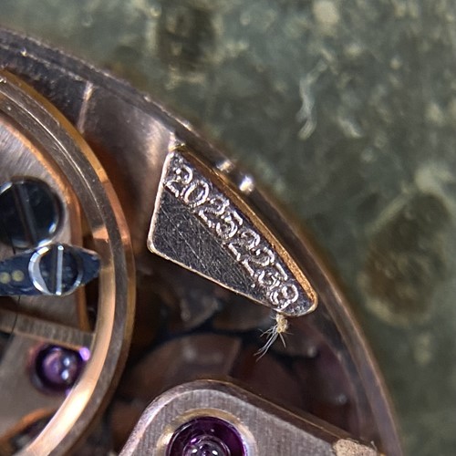 Lot 305 - Omega - A ruby and diamond-set concealed...