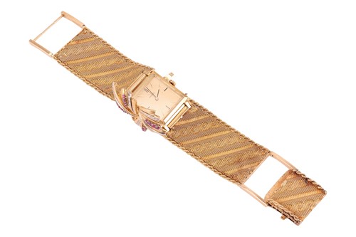 Lot 305 - Omega - A ruby and diamond-set concealed...