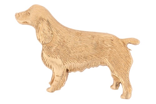 Lot 69 - A dog brooch in 18ct yellow gold, sculpted as...